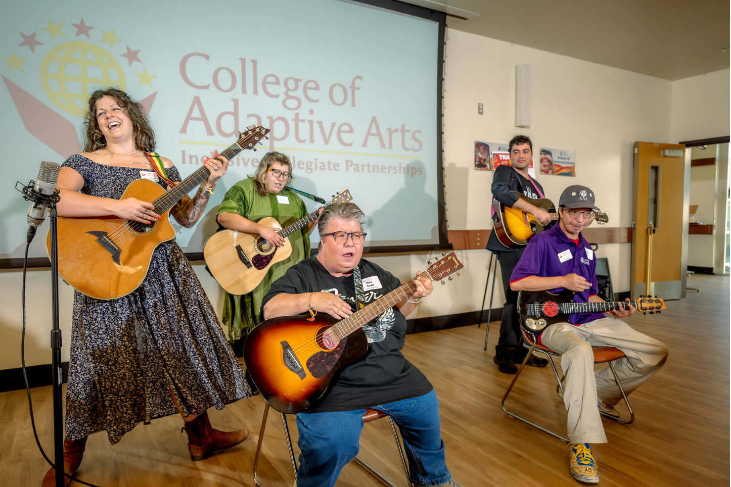 Students playing music with instructor