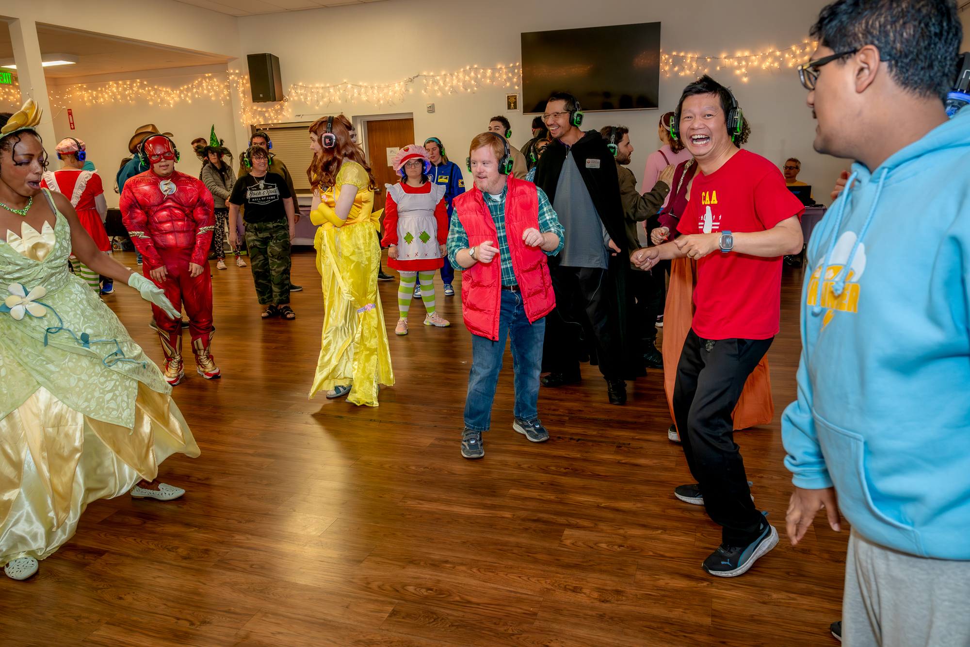 Students dancing together at a CAA social event